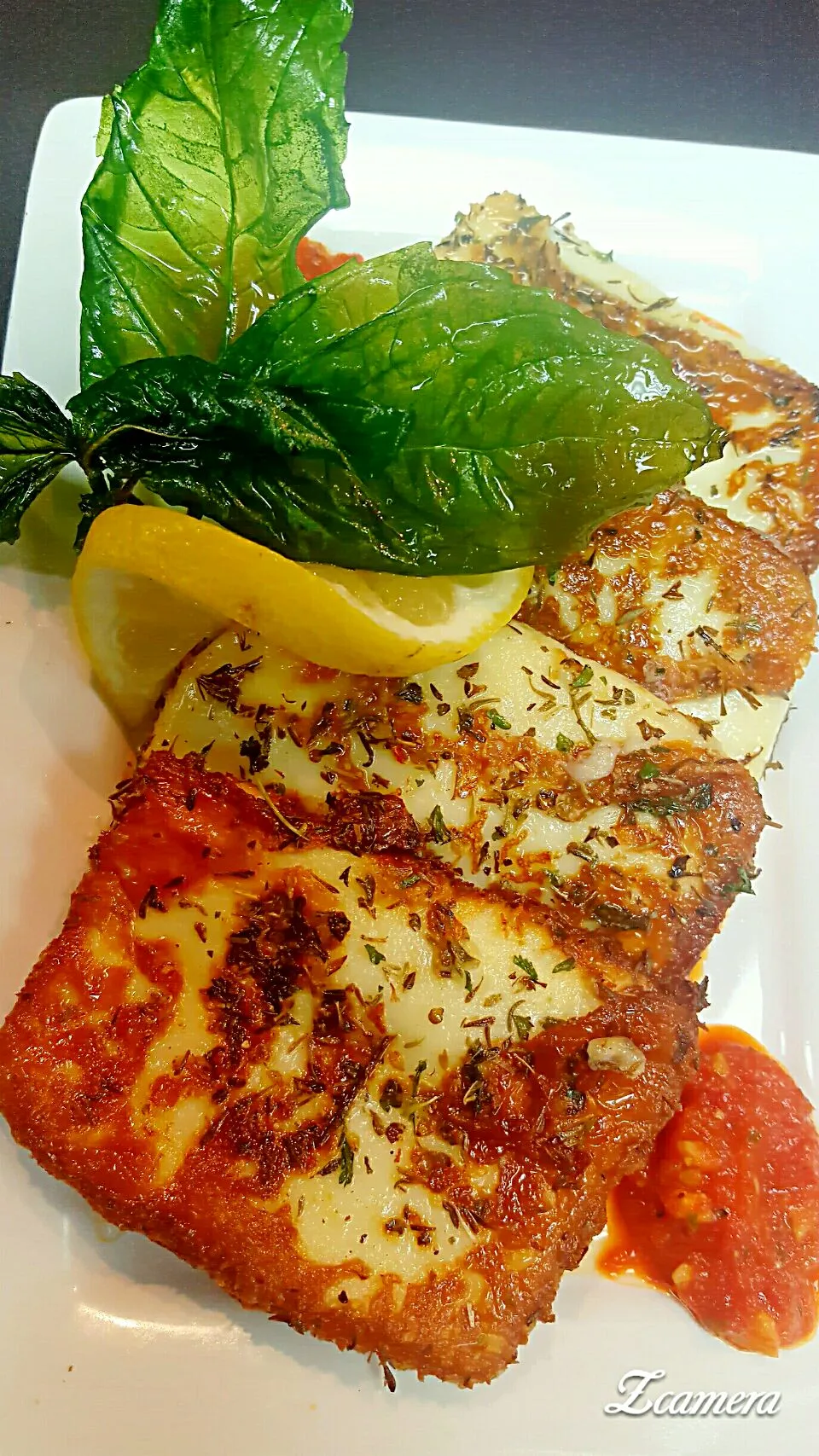 Pan seared queso friar cheese with Italian herbs,fried basil and romesco sauce....|chef Charlesさん