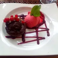 Snapdishの料理写真:Lava cake with raspberry sorbet|Sevi Kovacsさん