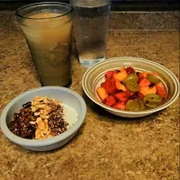 Snapdishの料理写真:Yogurt topped with Chocolate Cherry Berry Granola, Cashews, and Cocoa Quinoa Crumbles. Served with Fruit Salad.|bethさん