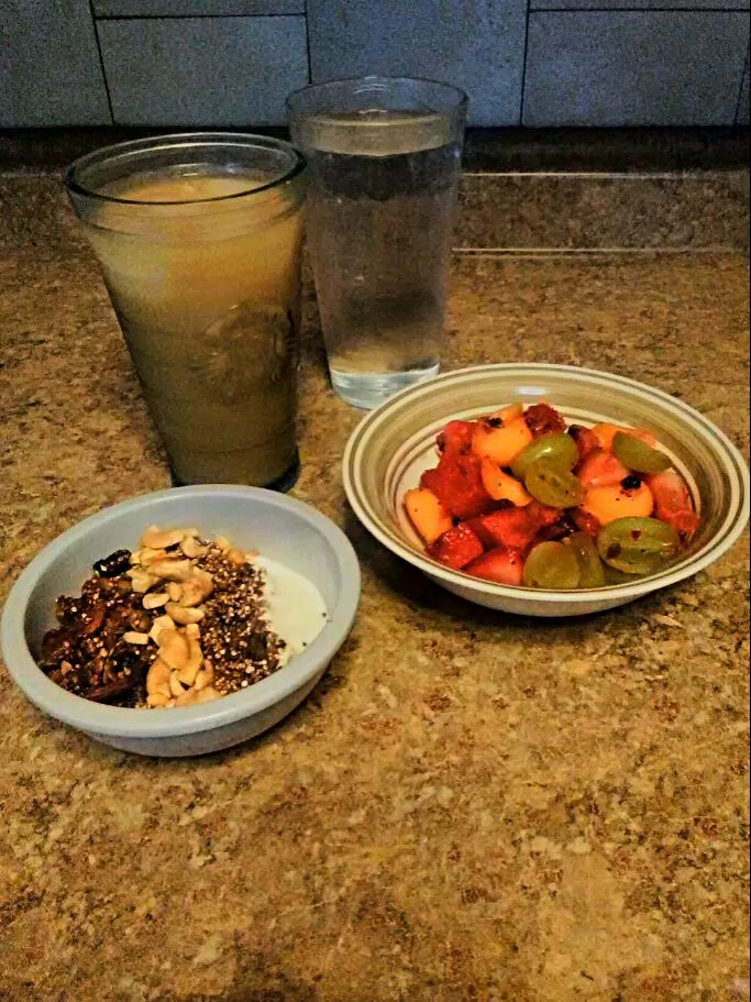 Yogurt topped with Chocolate Cherry Berry Granola, Cashews, and Cocoa Quinoa Crumbles. Served with Fruit Salad.|bethさん