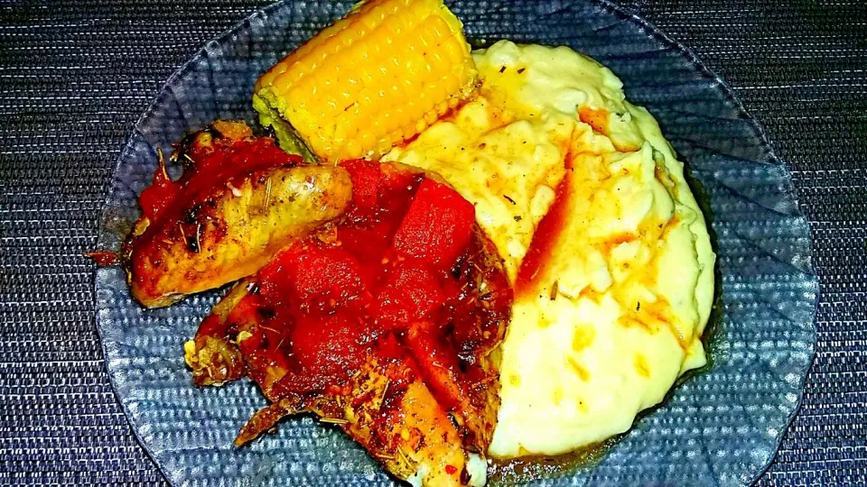 Snapdishの料理写真:Fire Roasted Tomatoes n Rosemary Chicken with Creamy Garlic Mashed Potatoes and Salty Sweet Corn on the Cob.|Juan Simmsさん