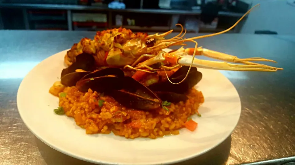 seafood paella...topped with a crab stuffed languistine....|chef Charlesさん