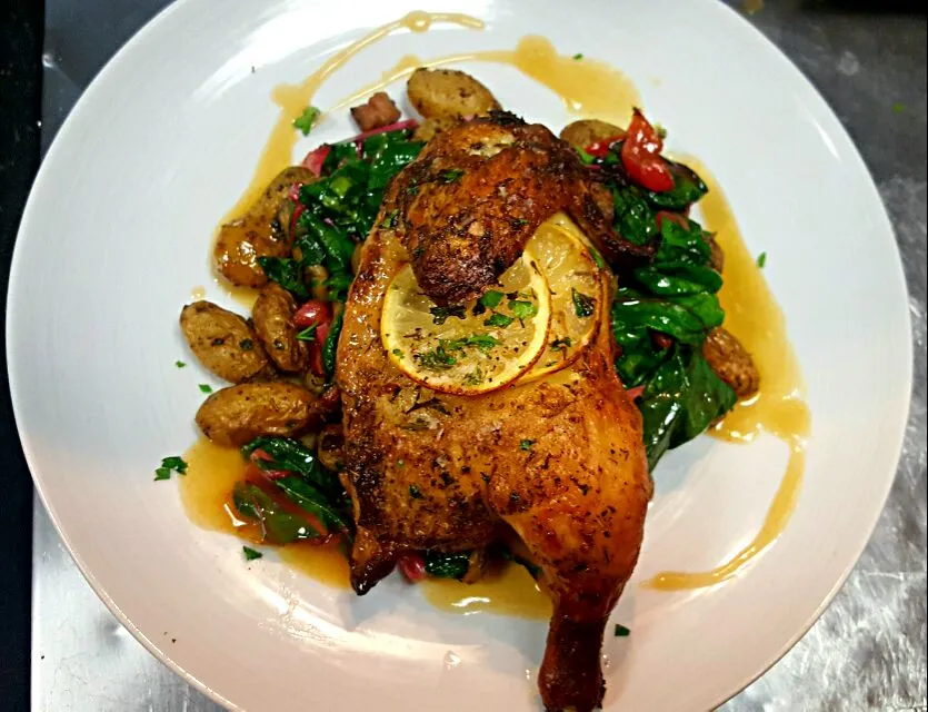 Herb roasted Cornish Game Hen ,served over Pork Belly Rendered Rainbow Chard and Roasted Fingerling Potatoes...finished with a Chicken Demi|chef Charlesさん