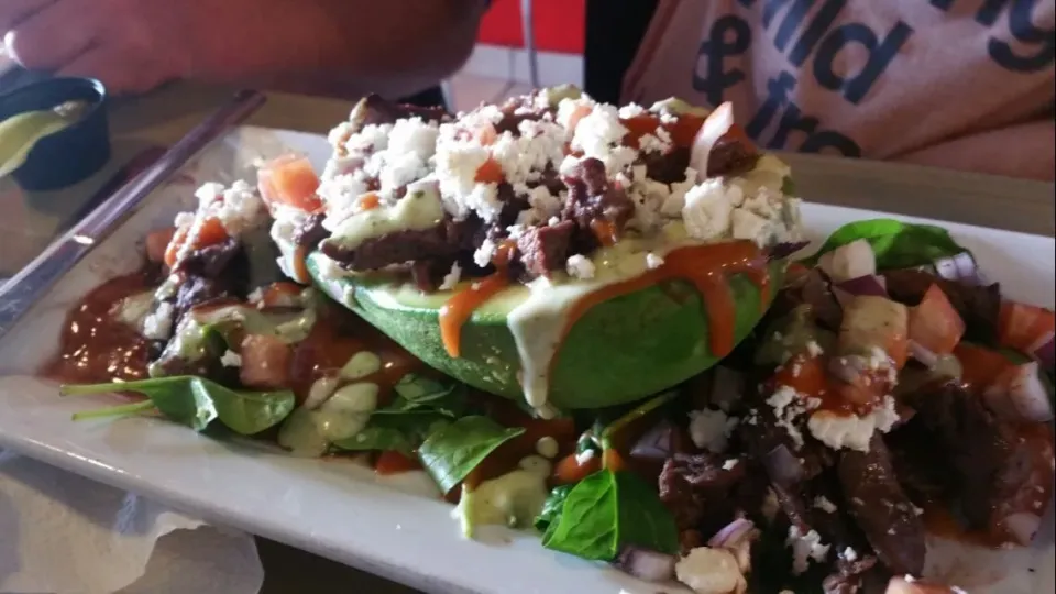 stuffed avocado with skirt Steak feta cheese and tomatoes and much more goodness.  Here in my beautiful island Puerto Rico. Just got in having lunch|Frank Ortizさん