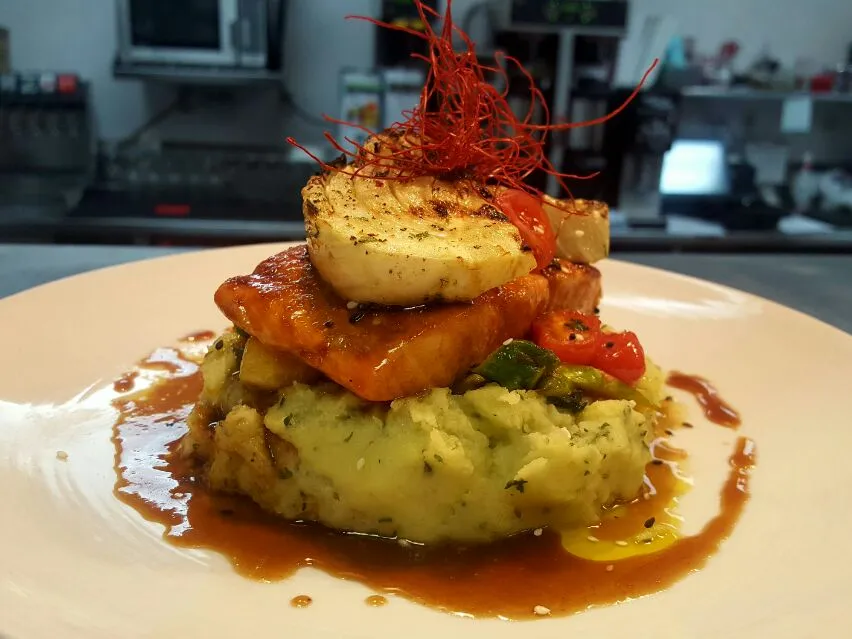 miso glazed salmon served over wasabi mashed potatoes with a asparagus and pineapple salsa and topped with grilled fennel..|chef Charlesさん