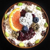 Coconut oats with fruits, granola, jam and nuts