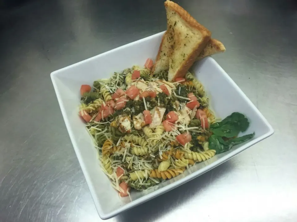 Snapdishの料理写真:tri colored spiral pasta , with walnut basil pesto and grilled chicken|Kenneth Flathersさん