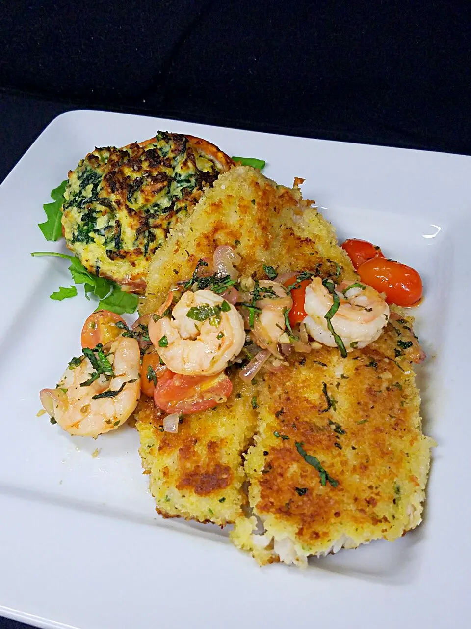 Snapdishの料理写真:parmasean crusted Tilipia with shrimp scampu and roasted spinach. along a ricotta stuffed hot house tomato.|Melissa Greenさん