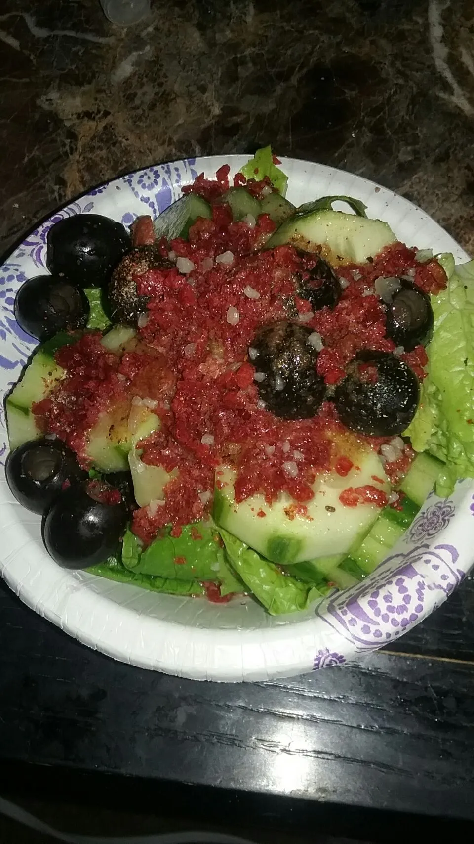 simple salad of lettuce,  cucumber,  olives and bacon bits.|Polly Gelfusoさん