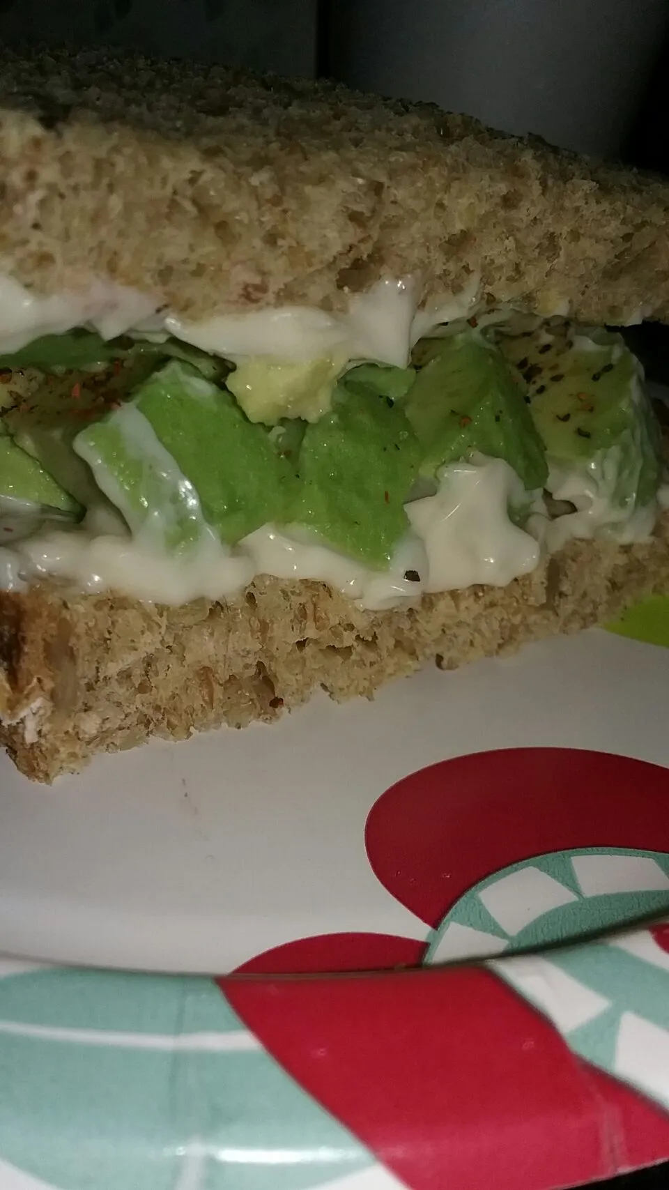 avocado and mayo sandwich on multi grain bread with sea salt and Sriracha pepper.|Polly Gelfusoさん