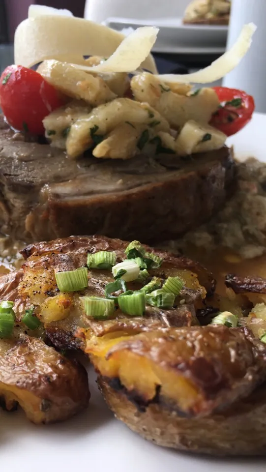 Snapdishの料理写真:Slow Roasted Lamb with Artichoke Tomato Fricassee and topped with Artichoke Parmesan Salad|Christine pavelkaさん