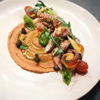 Grilled octopus with roasted tomato chickpea purée,pickled celery,crispy capers and basil