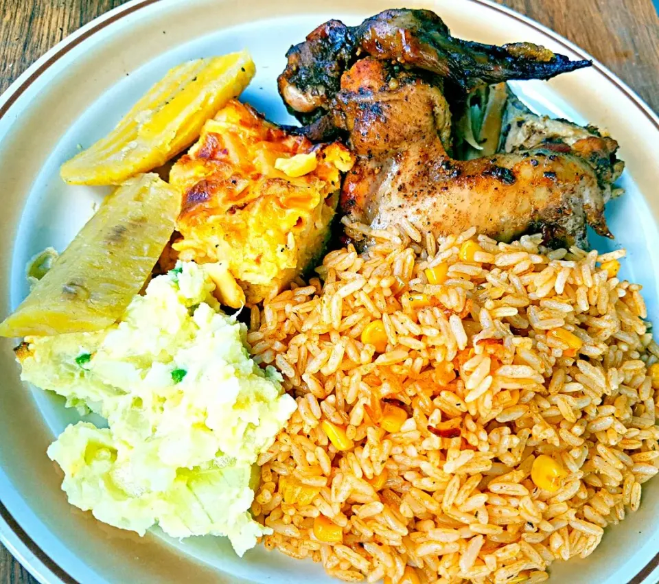 Jerk Baked Barbecue Chicken Wings Corn n Rice Baked Mac and Cheese Boiled Plantains and Potato Salad.|Juan Simmsさん