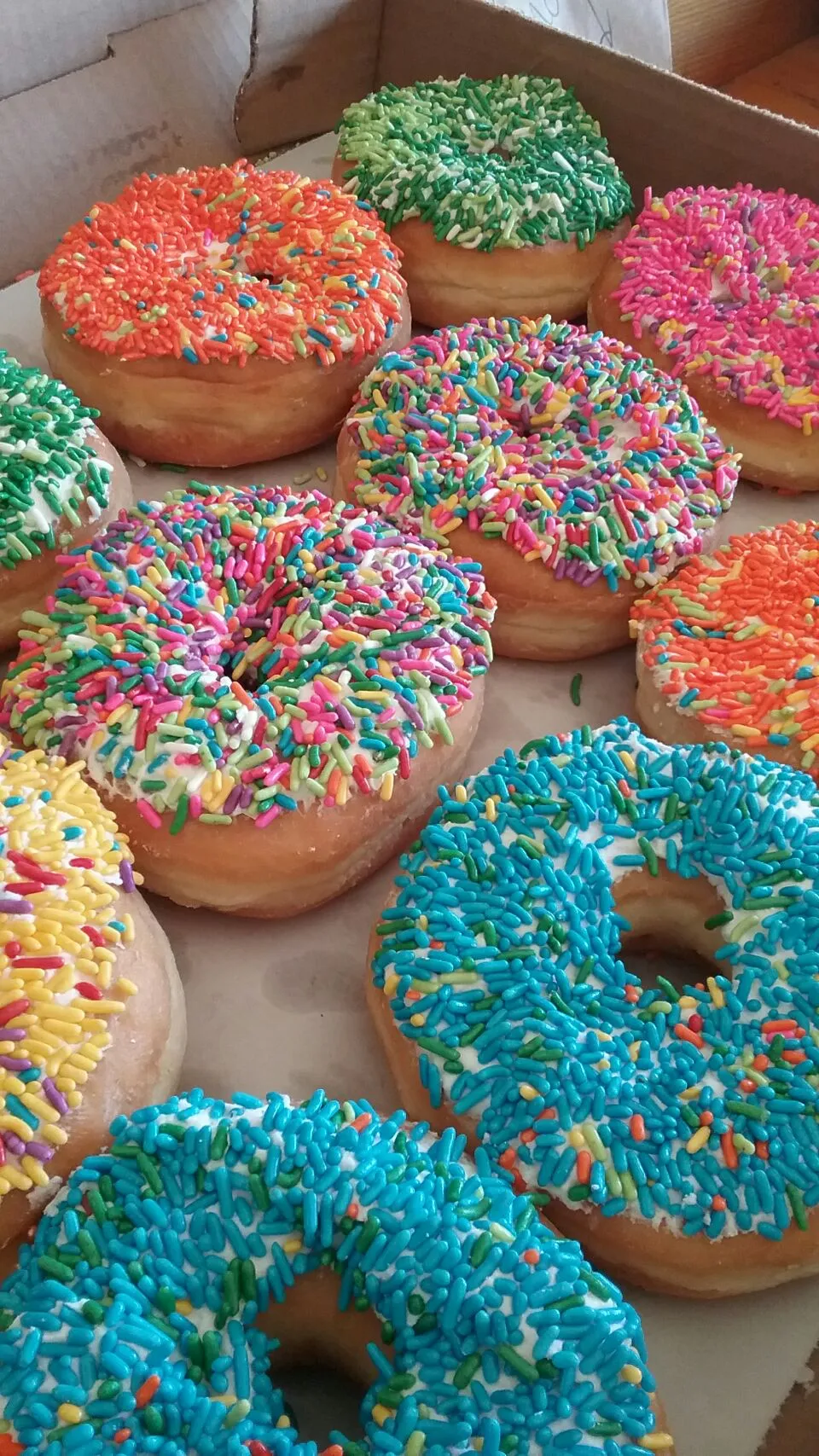 Snapdishの料理写真:pretty colored sprinkled glazed donuts!🍩🍩🍩|Polly Gelfusoさん