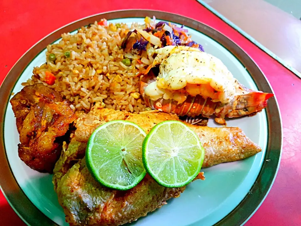 Fried Snapper with Fried Rice Grilled Lobster Tail Sauteed Cabbage and Carrots and Fried Plantains.|Juan Simmsさん