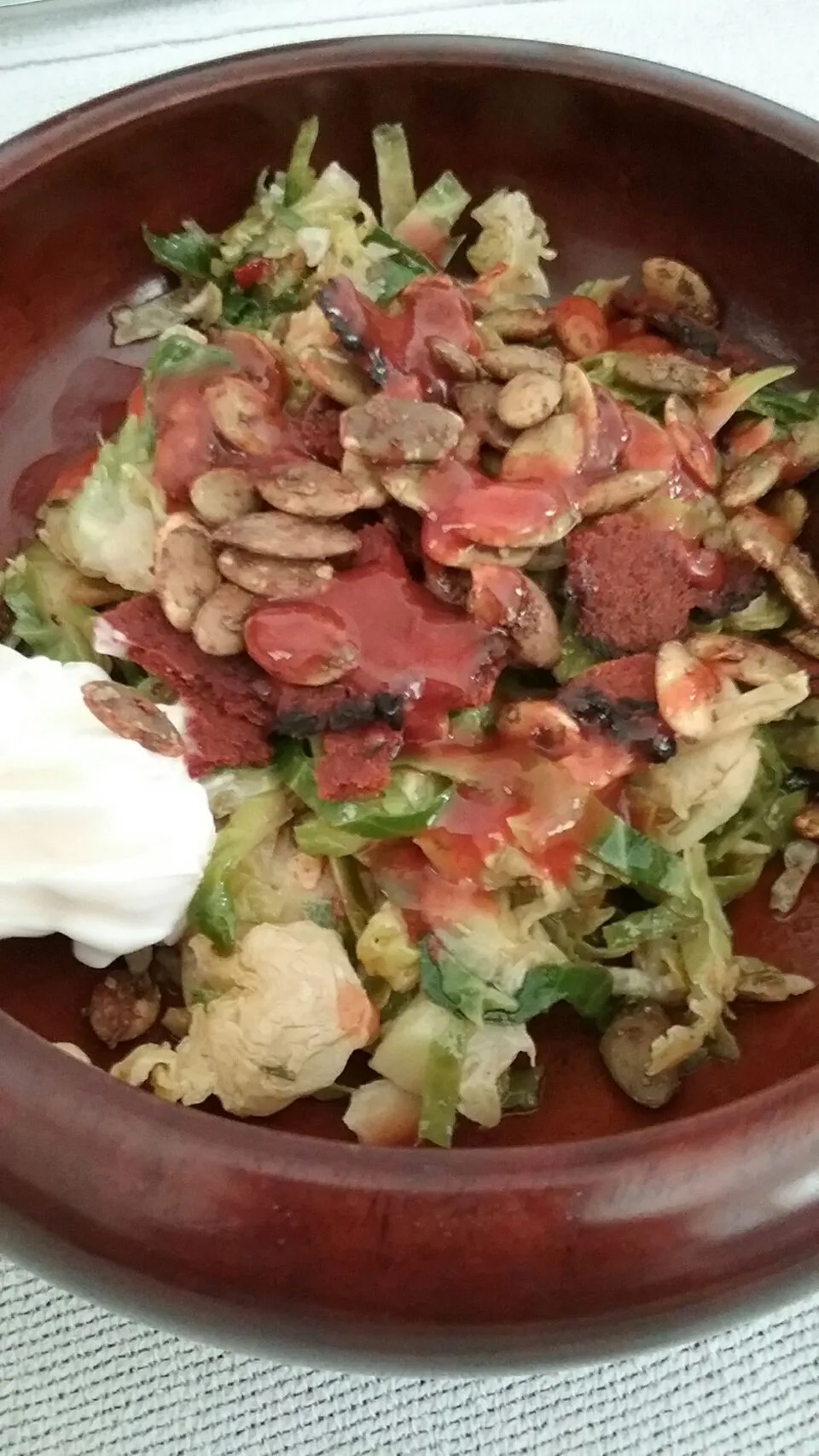 my new obsession,  another Brussels sprouts salad with papitas, mayo, hot sauce and bacon crumbles.|Polly Gelfusoさん