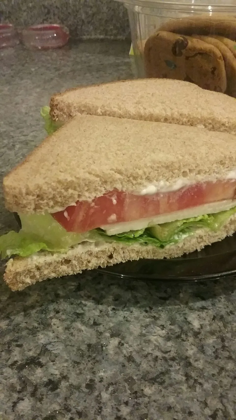 lettuce, tomato, provolone with mayo and salt on whole wheat bread.|Polly Gelfusoさん