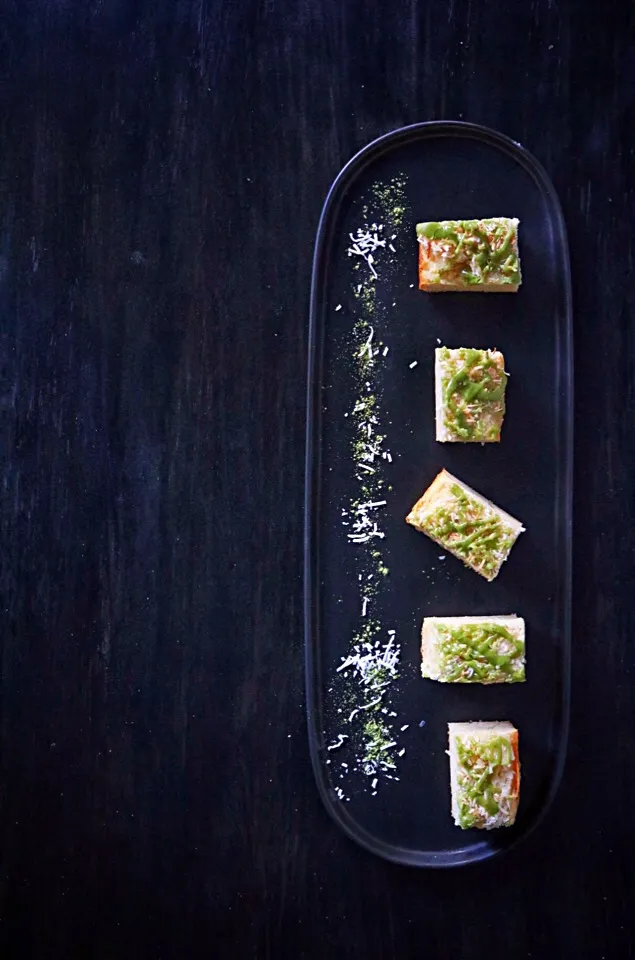 Snapdishの料理写真:Coconut Butter Mochi with Matcha Icing #icing #march #greentea  #coconut #Mochi #ButterMochi #dessert #japan #pastry #yummy|Amby Cakesさん