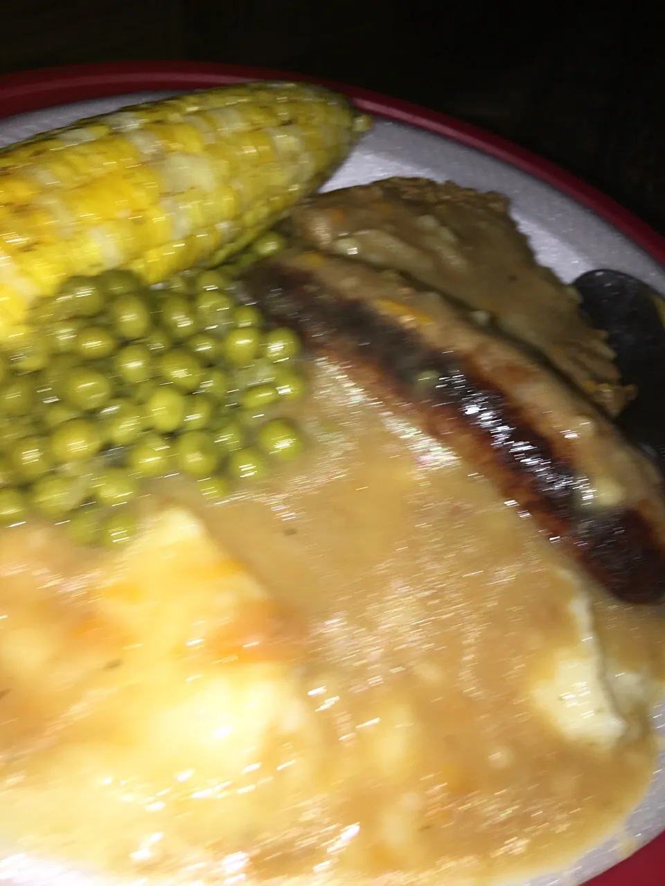 sausage ,swiss steak, gravy mashed potatoes and green peas|christl babcockさん