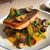 Snapdishの料理写真:Crispy salmon with fingerlings, corn, peas, crimini's, and a tomato beurre blanc.|Nate Merdellさん