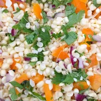 A side dish of sweet white corn, orange bell peppers, red onion, and cilantro. A sprinkle of salt and pepper and well as some ginger honey white balsamic|jeannette simmons jrさん