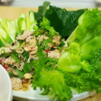 "Pra-moo" is Spicy pork salad in Thai style, Hot and spicy fromThai chillies, sour from lime and good smell from Thai herbs. This manu can refreshing you after 