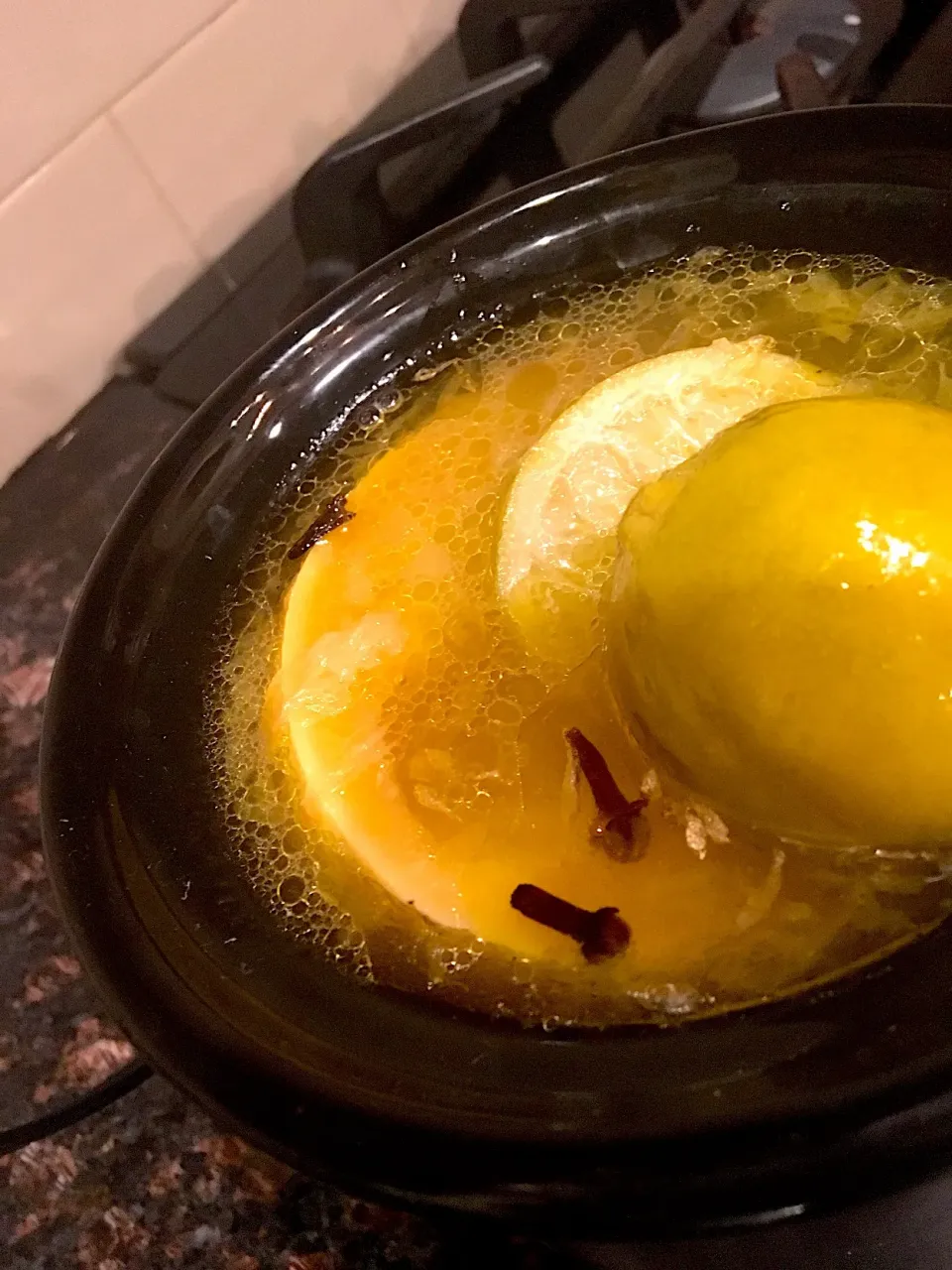 Snapdishの料理写真:I've never really used my mini Crock Pot. But on this chilly day, I put some over-ripe grapefruit and limes in water with a little olive pile and whole cloves. |emilyDeSantoさん