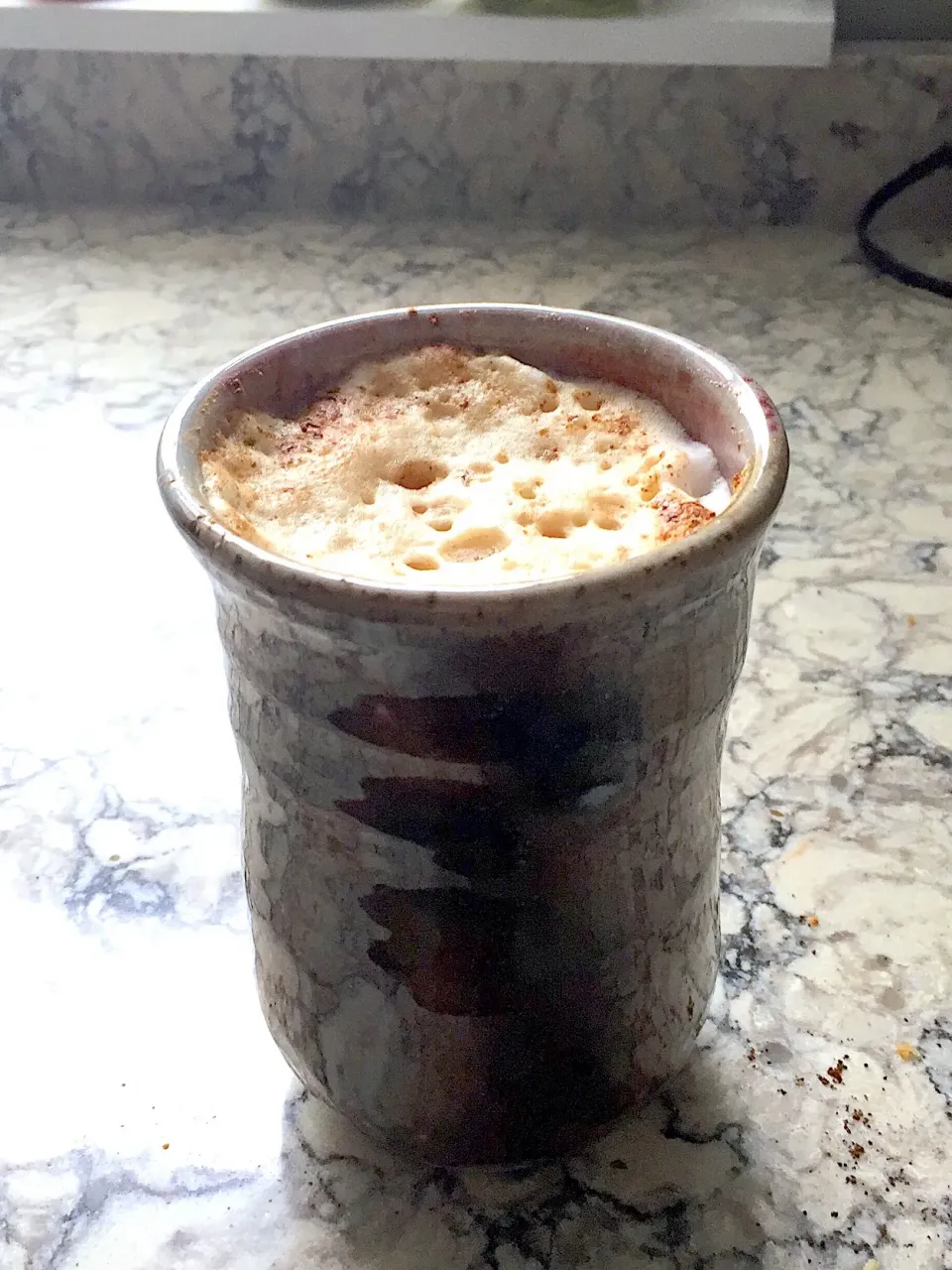 Cappuccino with sprinkled ground cinnamon, cardamom, and cayenne on top.|Debra Mannさん