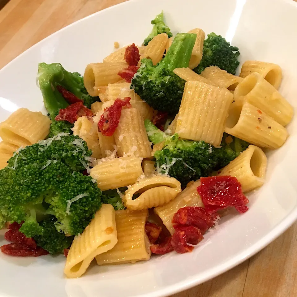 Snapdishの料理写真:Meza Rigatoni with sun dried tomato and anchovy sauce, tossed with broccoli and pecorino/Romano cheese. This makes the hubs real happy.|emilyDeSantoさん