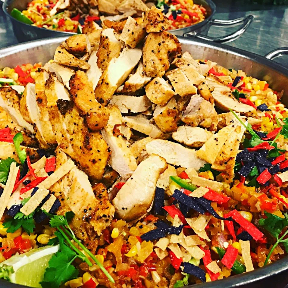 Giant Fiesta Rice Bowls...Sauteed Peppers and Onions, Garlic, Corn, Cilantro, Limes, Tortillas, topped with Spice Rubbed Chicken Strips|Crystal Carltonさん