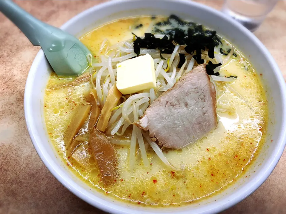 Snapdishの料理写真:味噌カレー牛乳ラーメン（バター入り）¥830|Blue Moon Caféさん