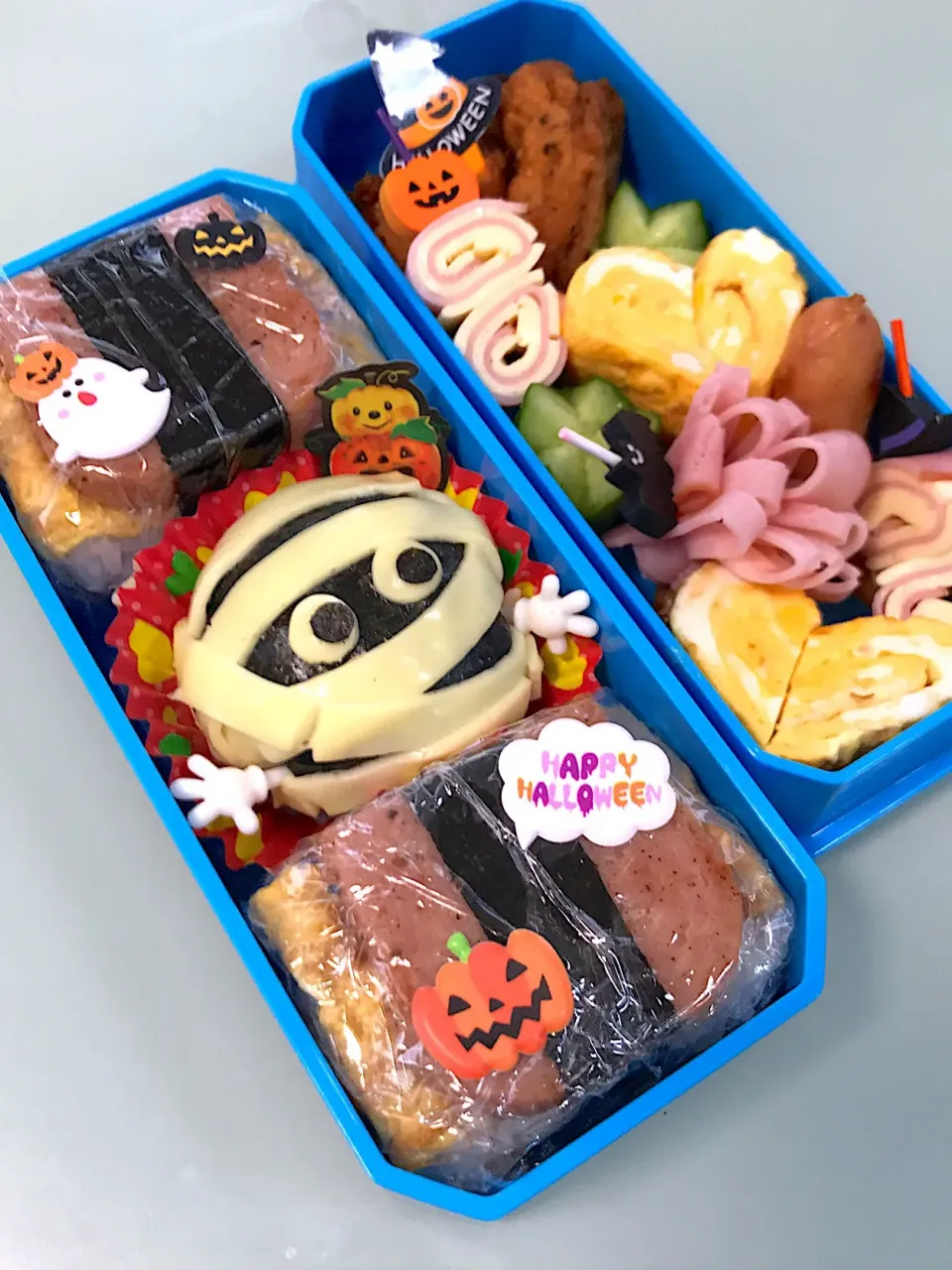 Snapdishの料理写真:キャラ弁〜ハロウィン🎃ver.ミイラとポーク卵🍙♪|くるりん★さん