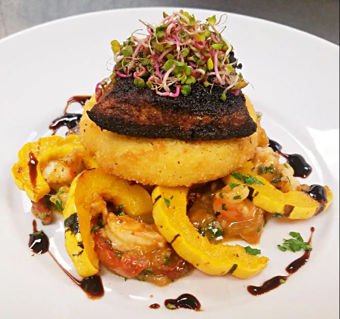 blackened mahi, served over shrimp etoufee with delicate squash and a fried pepperjack polenta cake...|chef Charlesさん