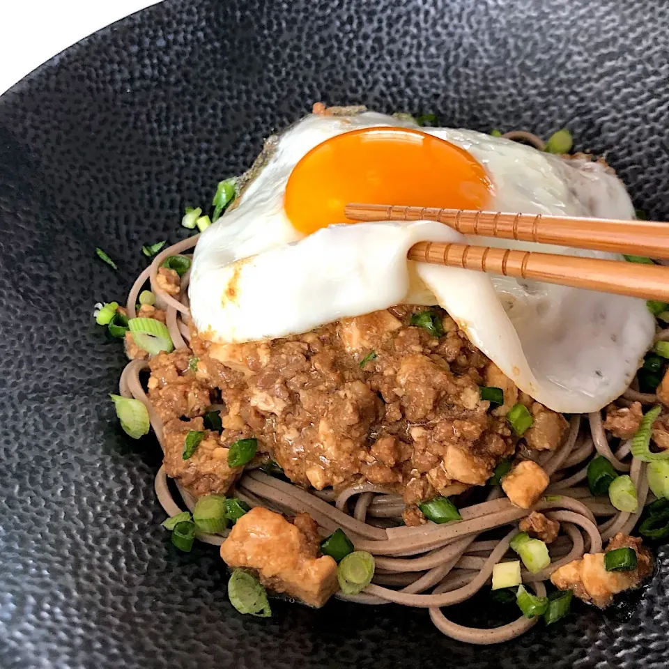 Buckwheat noodles, braised minced pork with tofu, sunny side up egg.|12Dragonさん