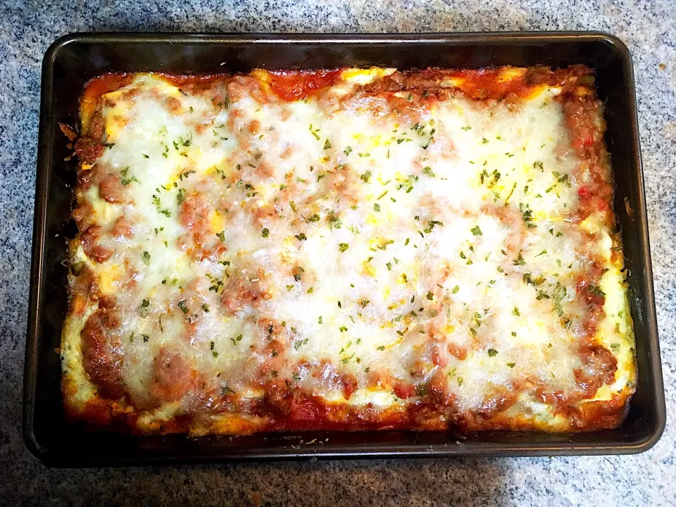 Snapdishの料理写真:Lasagna with beef, spicy Italian sausage, garlic, zucchini, onion, red pepper, jalapeño, mozzarella, Parmesan, ricotta  and spices|Michaels Culinary Adventuresさん