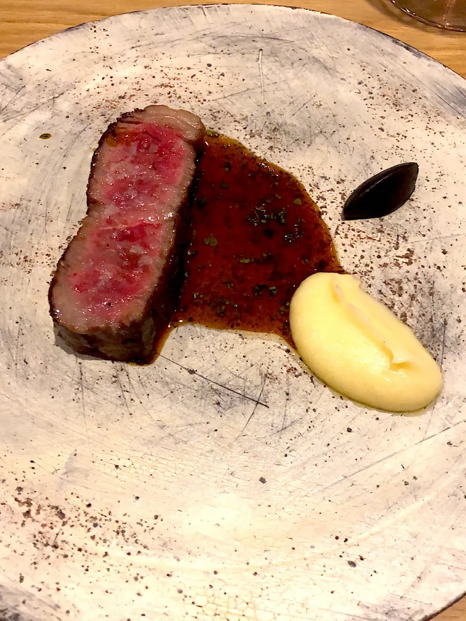 Dry aged japanese beef with fermented potato and black garlic|Sergey Grisさん