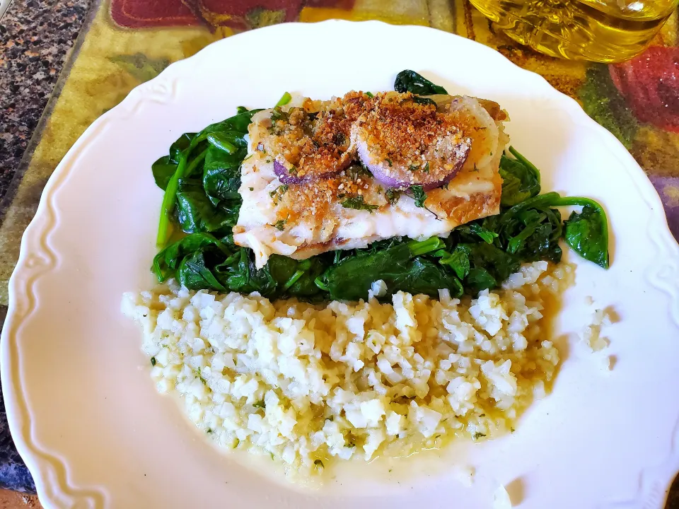 Snapdishの料理写真:Baked Striped Bass  cauliflower Rice.Baby
spinach.👍|Frank Ortizさん