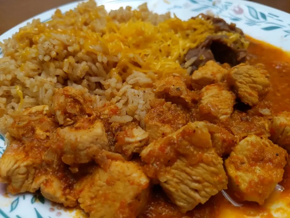 Adobo Chicken UIP Pg. 52. served with Spanish rice and refried beans|knoさん