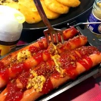 Snapdishの料理写真:ドイツ料理🇩🇪 カリーブルスト　フォークぶっ刺し