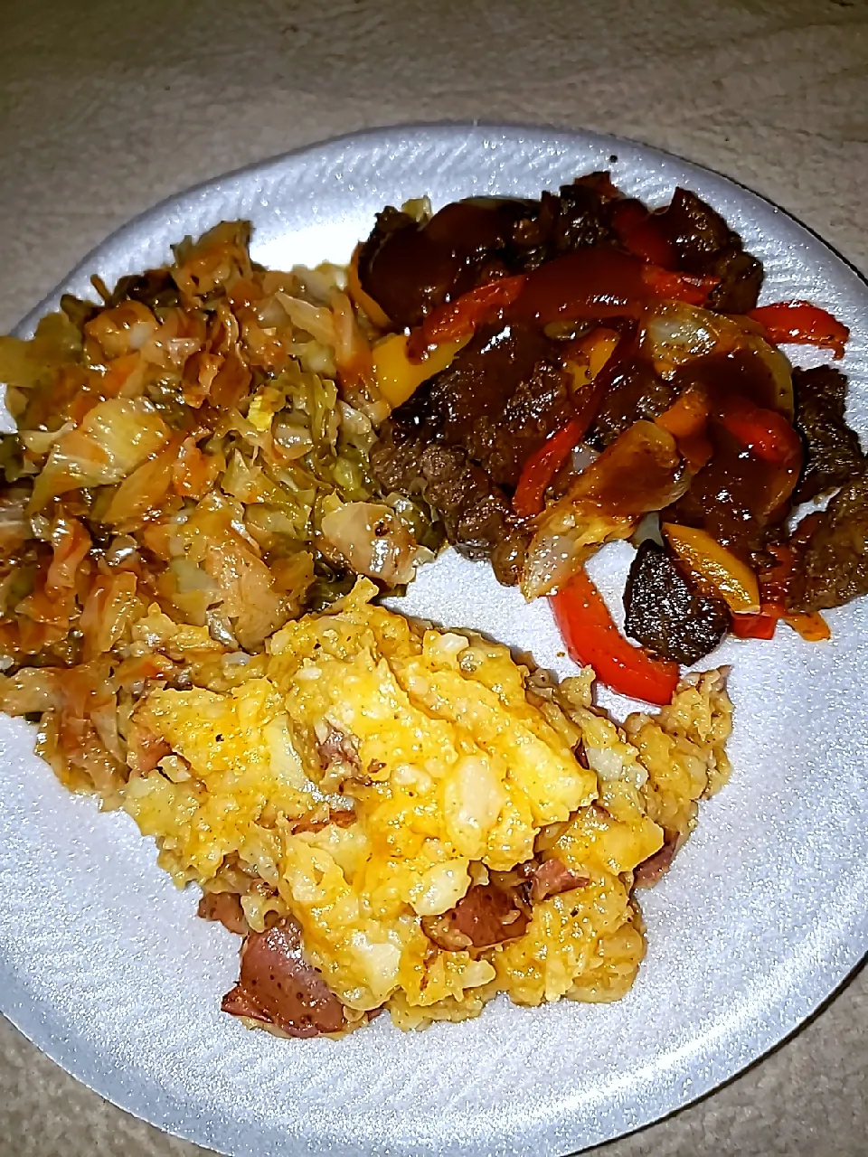 grilled steak with onions and peppers with garlic smashed red potatoes and fried cabbage|Krystal Daneen Smith-Royallさん