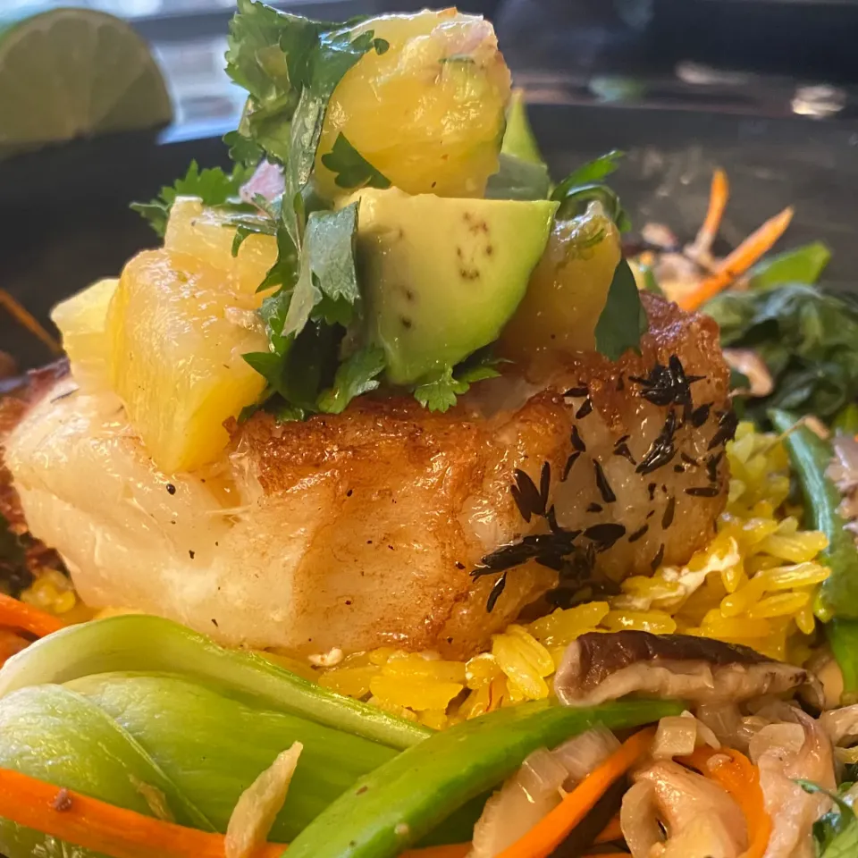 Seared Sea Bass with a Pineapple Avocado Salsa on Saffron Rice with Bok Choy Snap Peas Shitake mushrooms and carrots|Christine pavelkaさん