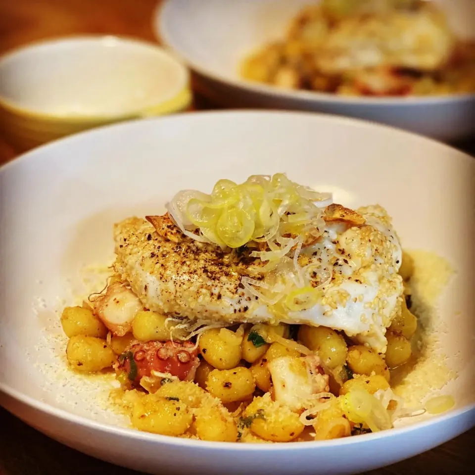 Thai Fish Fillet baked in Butter Sesame seeds & Garlic on Top Pan Fried Gnocchi in Sesame oil with Fresh Octopus, Chives , Garlic  with Parmesan #homecooking #i|Emanuel Hayashiさん