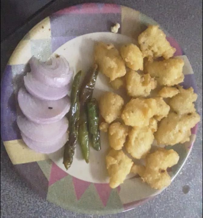 Snapdishの料理写真:Dal Vada with Fried Green Chillis + Onions|Ratna Widhaniさん