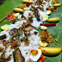 Snapdishの料理写真:Boodle Fight. Everyone eats on the banana leaf using bare hands.