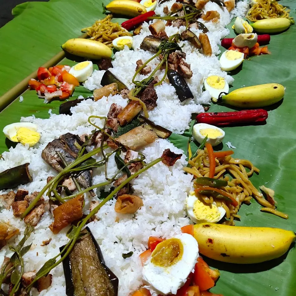 Snapdishの料理写真:Boodle Fight. Everyone eats on the banana leaf using bare hands.|shehphさん