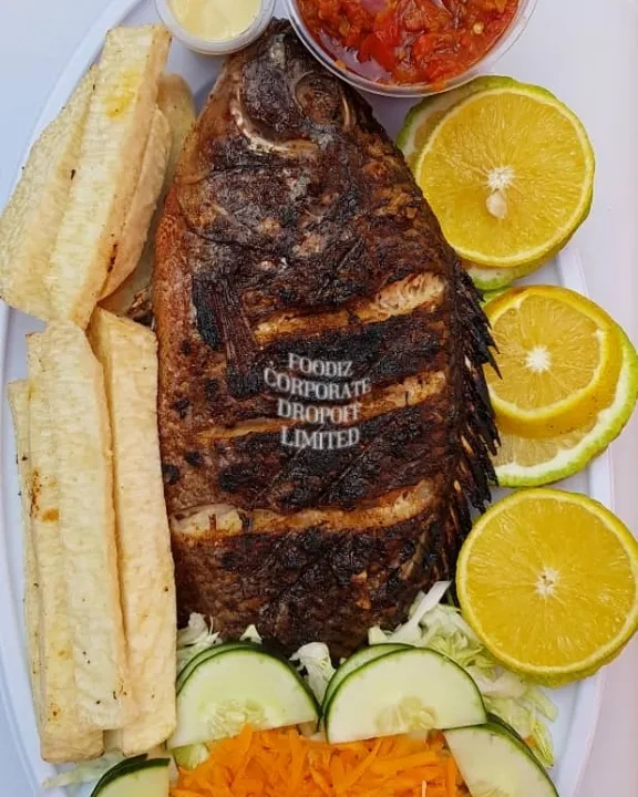 Home grilled #tilapia fish served with fried yam / sauce  and salad |foodiz dropoffさん