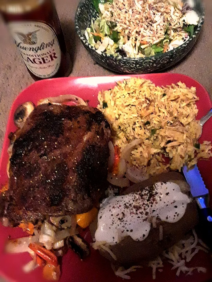 Pan seared wagyu beef sauteed mushrooms onions and peppers chicken fried rice and a baked potato with sour cream and habanero and jalapeno cheese and a salad wi|Lou S. Alexanderさん