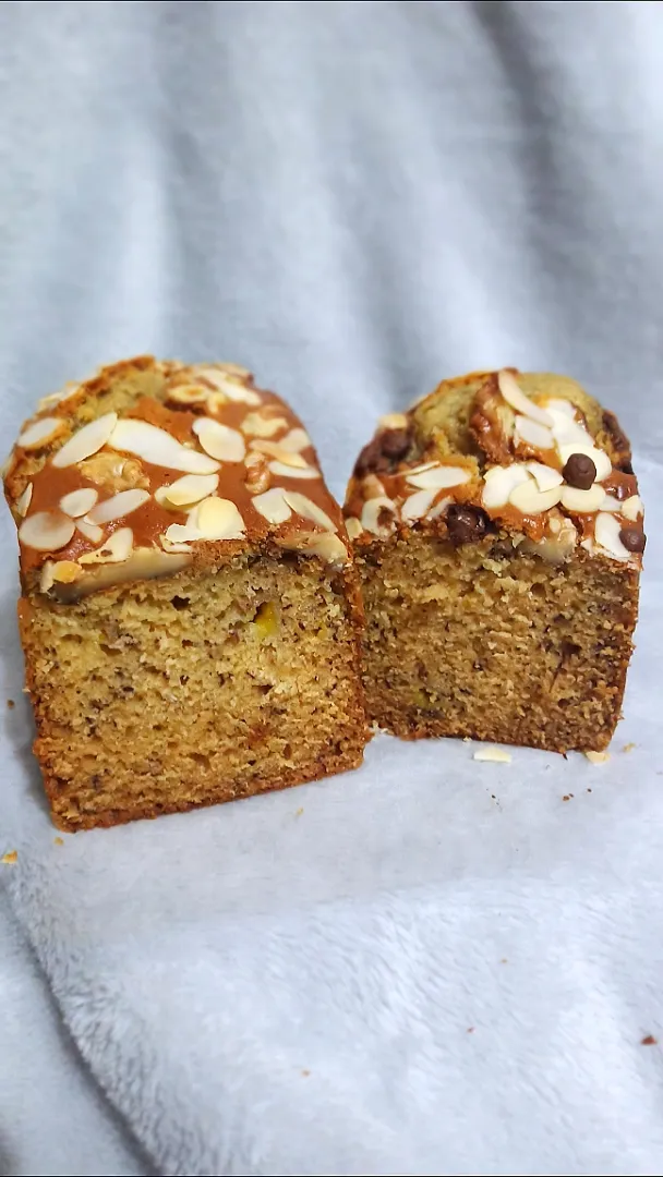 Banana loaf bread with almond slice walnuts and choco chips on top|ghretzさん