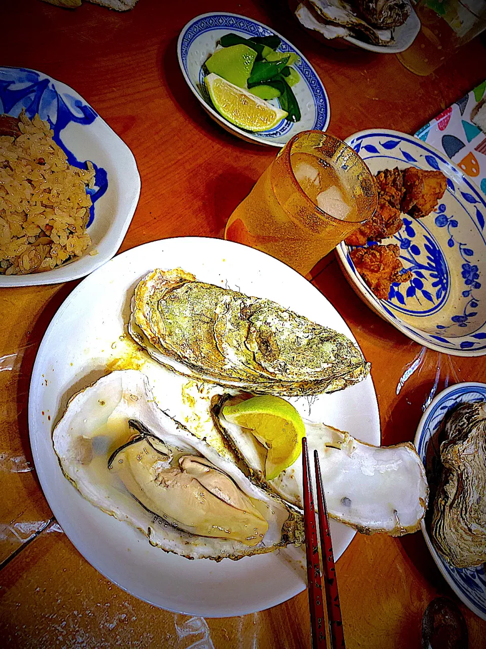 蒸し牡蠣　レモン搾り🍋　鶏醤油唐揚げ　タコの炊き込みご飯🐙　キュウリの浅漬け🥒|ch＊K*∀o(^^*)♪さん