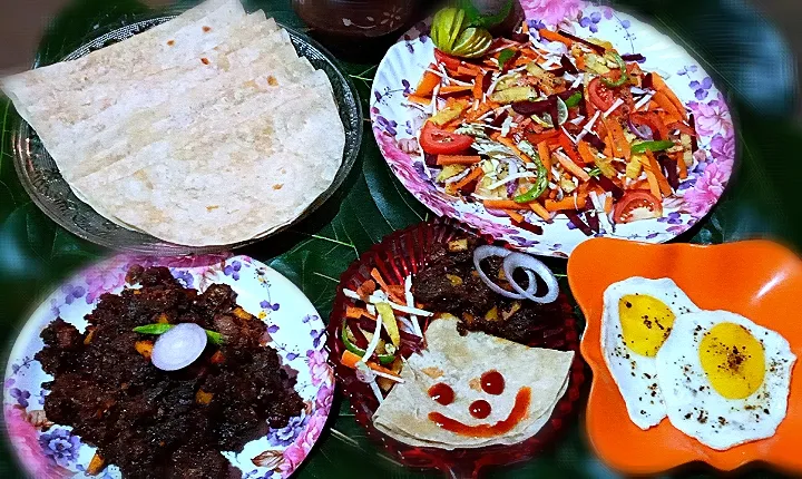 Snapdishの料理写真:Indian rotti and beef ularttiyat with salad and bullseye|Binija.m.sさん